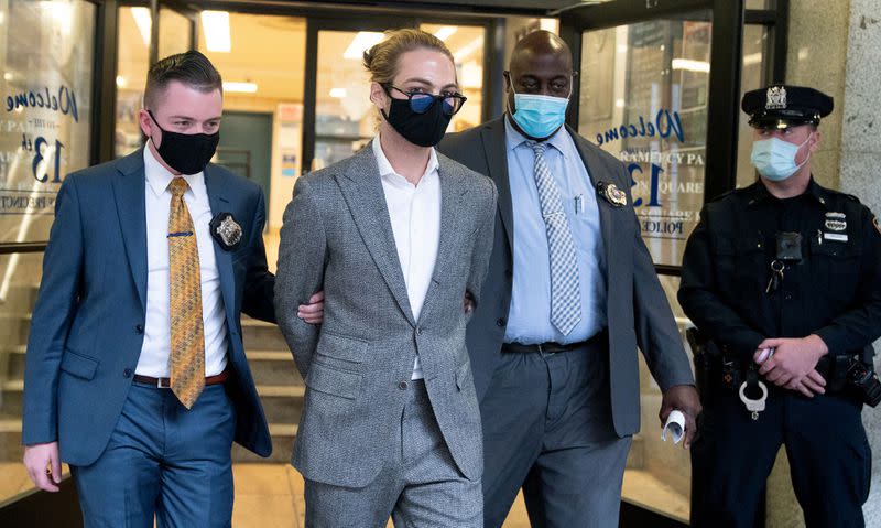 Nathaniel Direnzo seen leaving the 13th Precinct is escorted from the New York City Police Department’s 13th Precinct Son aturday, Oct. 23, 2021. (Photo: New York Daily News)