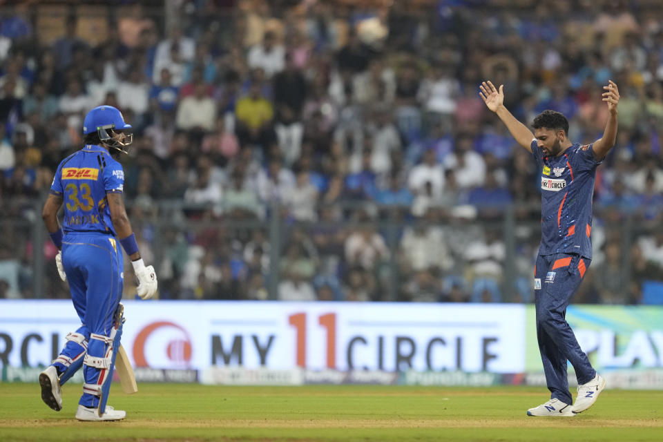 Lucknow Super Giants' Naveen-ul-Haq celebrates the dismissal of Mumbai Indians' captain Hardik Pandya , left, during the Indian Premier League cricket match between Mumbai Indians and Lucknow Super Giants in Mumbai, India, Friday, May 17, 2024.(AP Photo/ Rafiq Maqbool)