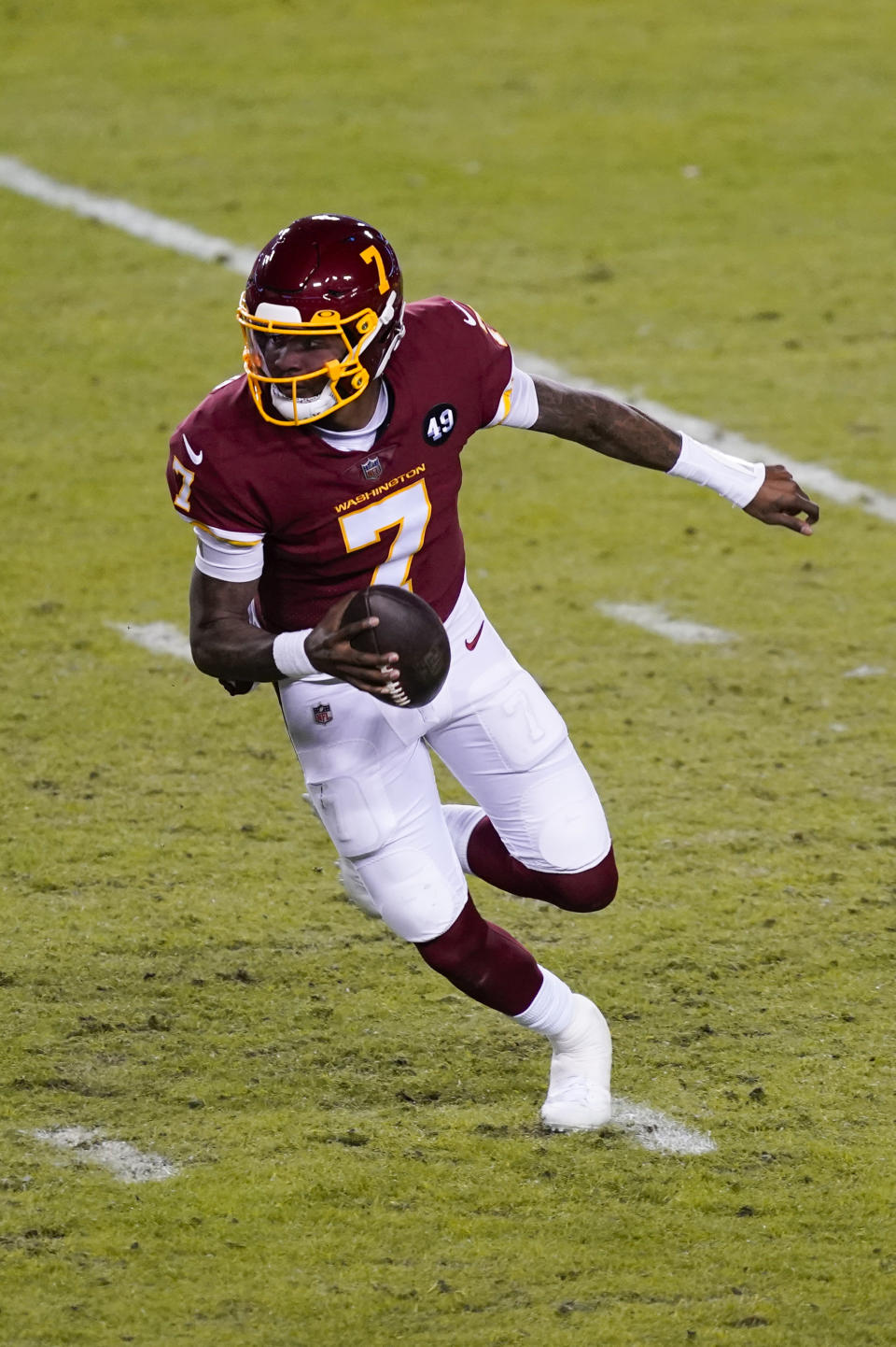 Washington Football Team quarterback Dwayne Haskins (7) runs with the ball during the first half of an NFL football game against the Carolina Panthers, Sunday, Dec. 27, 2020, in Landover, Md. (AP Photo/Mark Tenally)