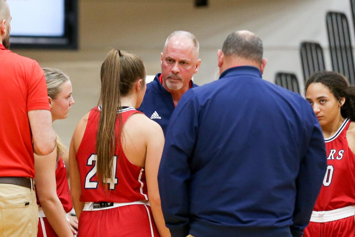 Bedford North Lawrence Coach Jeff Allen speaks with hi team during a time out as Bedford North Lawrence takes on Center Grove High School in the Girls Class 4A IHSAA Region 7 basketball championship, Feb 10, 2024; Bedford, IN, USA; at Bedford North Lawrence High School.