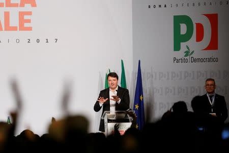 Former Italian Prime Minister Matteo Renzi (L) gestures as he talks during a meeting of Democratic Party (PD) in Rome, Italy February 19, 2017. REUTERS/Remo Casilli