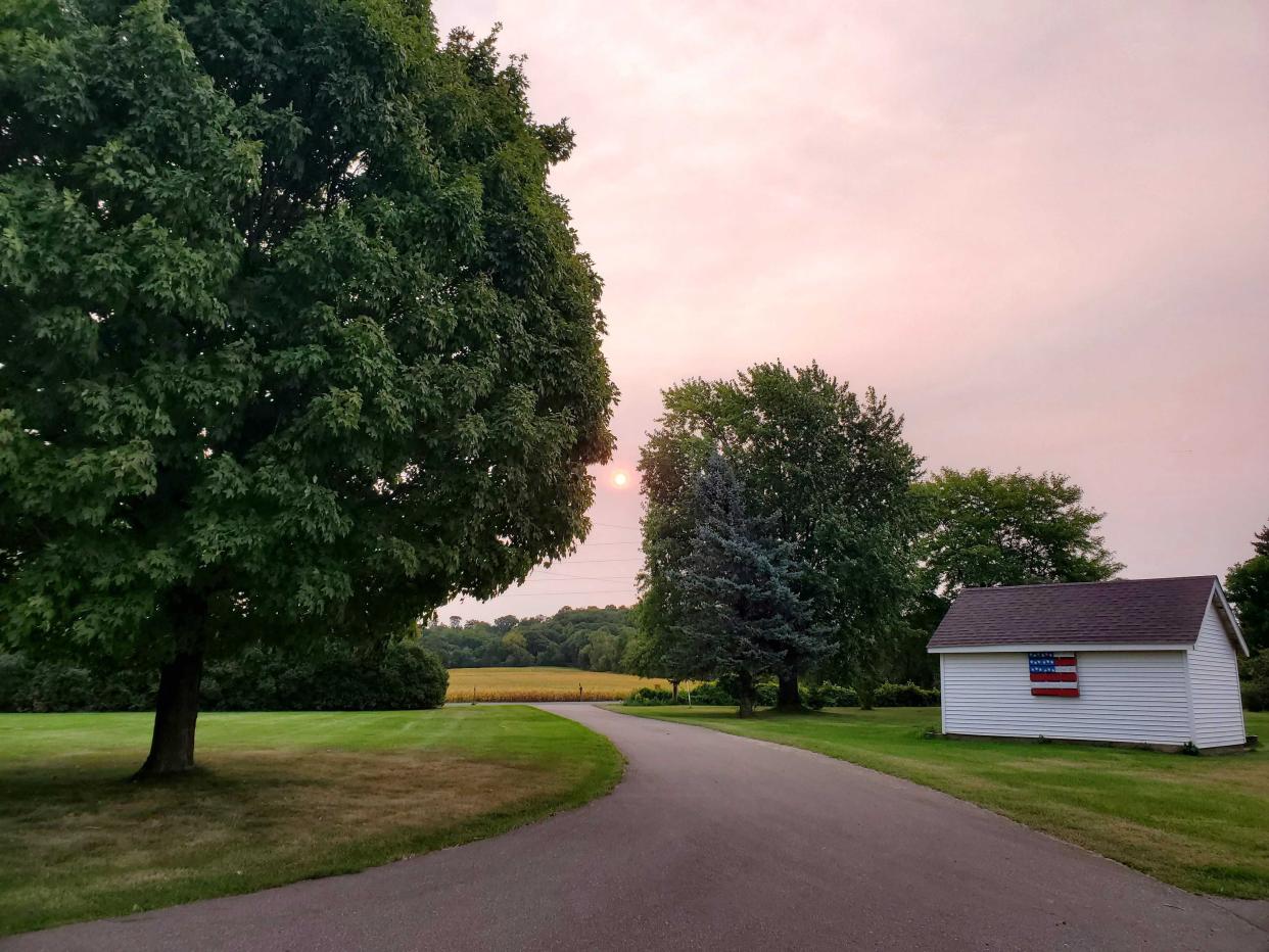 smoke turns skies pink wisconsin