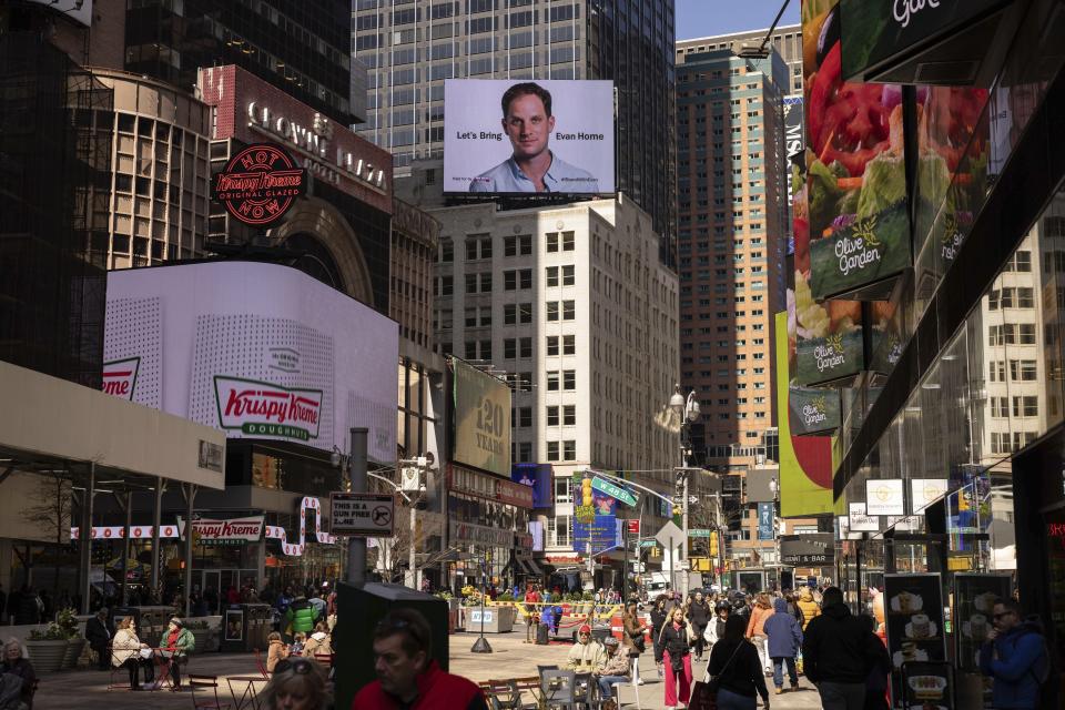 FILE - A billboard calling for the release of Wall Street Journal reporter Evan Gershkovich is seen in New York’s Times square on the first anniversary of his jailing in Russia, on March. 29, 2024. Fifteen months after he was arrested in the city of Yekaterinburg on espionage charges, Gershkovich returns there for his trial starting Wednesday, June 26, 2024. Gershkovich, his employer and the U.S. government deny the charges. (AP Photo/Yuki Iwamura, File)