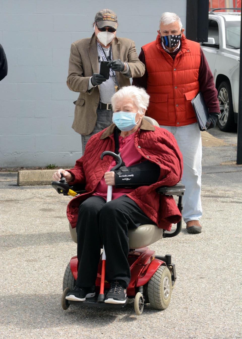 In this file photo, Ethel Haugland, 76, of Norwich tries out her refurbished motorized wheelchair given to her by Phil Pavone, left, owner of AZ Pawn in Norwich Friday. At right is volunteer Bob O'Shaughnessy of Mystic.