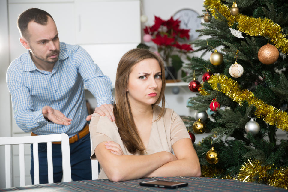 upset couple at a dinning room table