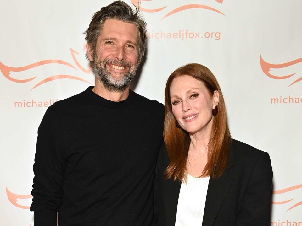 <p>Bryan Bedder/Getty</p> Bart Freundlich and Julianne Moore perform onstage at 2023 A Funny Thing Happened On The Way To Cure Parkinson