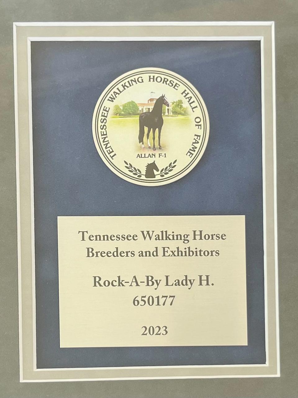 Rock-A-Bye Lady's plaque for the Tennessee Walking Horse Breeders and Exhibitors' Association Hall of Fame is pictured. (The plaque carries the mare's original registered name.)