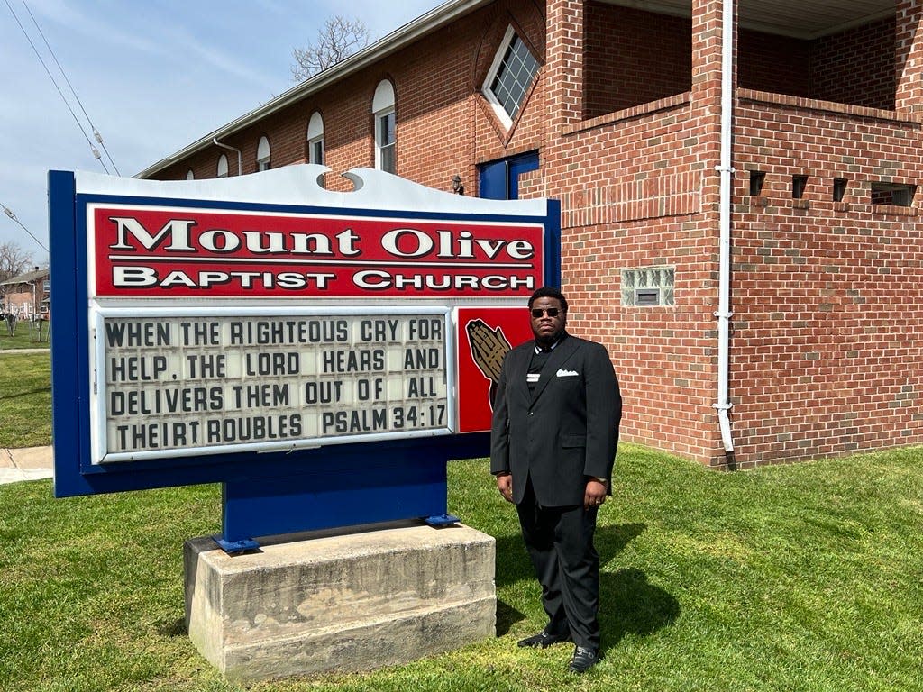 Pastor Rashad Singletary stands at his church in the Turner Station community near the Port of Baltimore and the Francis Scott Key Bridge collapse on March 26, 2024, in Dundalk, Maryland. After the crash at the bridge, the church is scheduled to host a prayer vigil today, Singletary said.