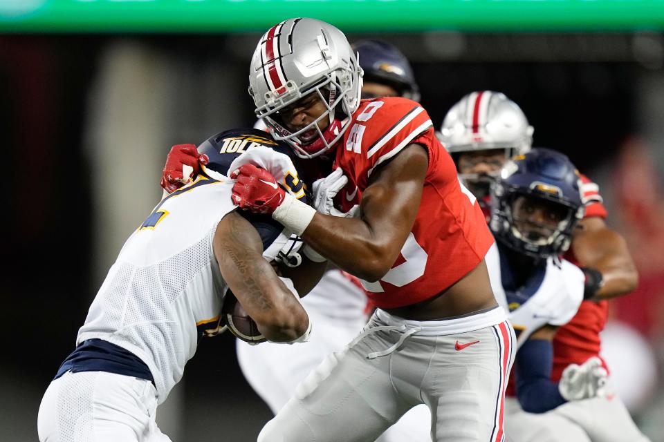 Sep 17, 2022; Columbus, Ohio, USA; Ohio State Buckeyes safety Sonny Styles (20) tackles Toledo Rockets running back Willie Shaw III (32) during the second half of the NCAA Division I football game at Ohio Stadium. Ohio State won 77-21. Mandatory Credit: Adam Cairns-The Columbus Dispatch