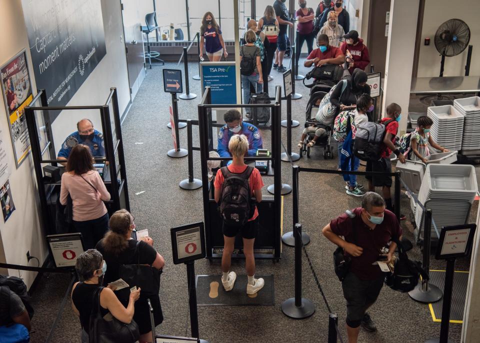 Passengers go through a security checkpoint inside Trenton-Mercer Airport on Monday, July 26, 2021. [MICHELE HADDON / PHOTOJOURNALIST]