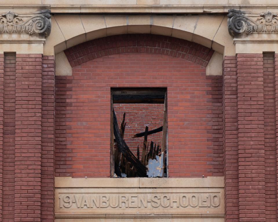 Burned wood and framing materials from the roof of the Van Buren School can be seen following a Dec. 3 fire.