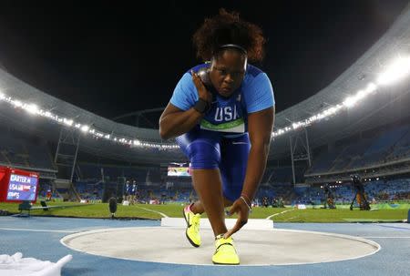 FILE PHOTO: 2016 Rio Olympics - Athletics - Final - Women's Shot Put Final - Olympic Stadium - Rio de Janeiro, Brazil - 12/08/2016. Michelle Carter (USA) of USA competes on her way to the gold medal in the women's shot put. REUTERS/Kai Pfaffenbach