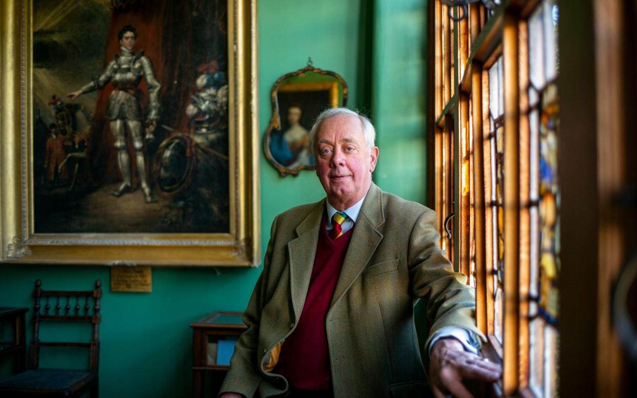 Francis Dymoke with a painting of Henry Dymoke who was the King’s Champion for George IV on July 19 1821 - Heathcliff O’Malley for the Telegraph