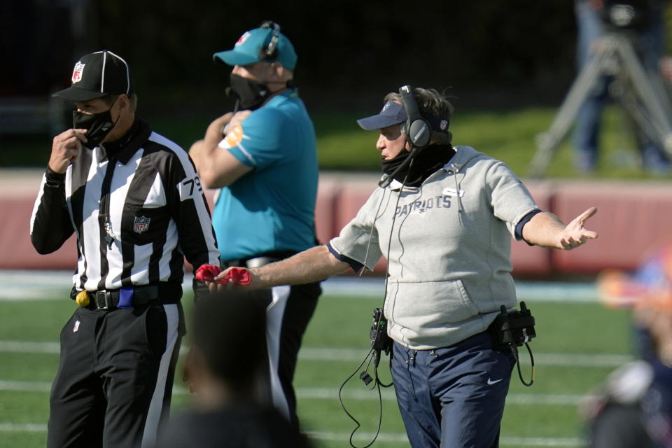 New England Patriots head coach Bill Belichick, right, appeals to down judge Kent Payne in the second half of an NFL football game against the Denver Broncos, Sunday, Oct. 18, 2020, in Foxborough, Mass. (AP Photo/Charles Krupa)