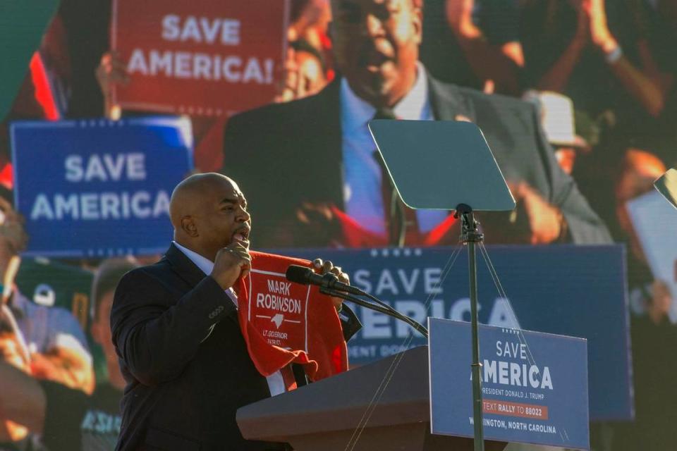 Supporters cheer as Lt. Gov. Mark Robinson speaks during a rally featuring former president Donald Trump at Wilmington International Airport Friday, Sept. 23, 2023.