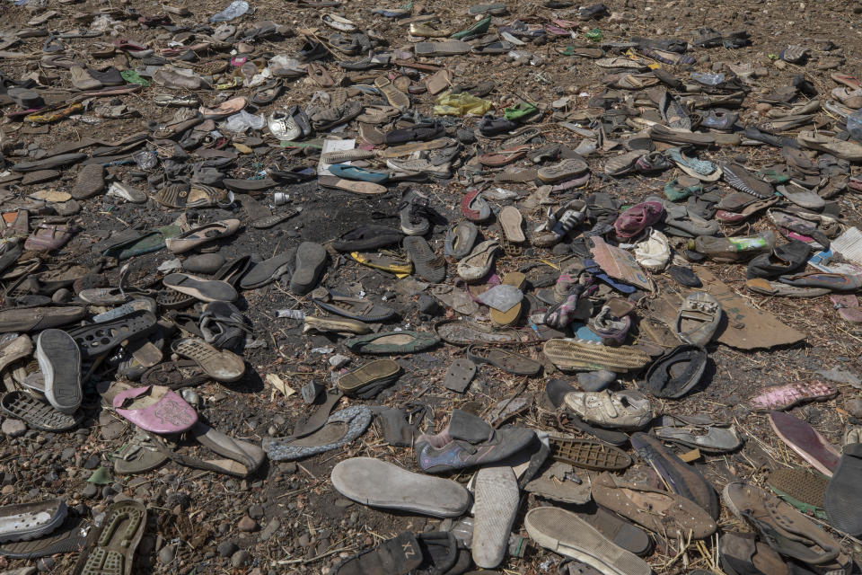 Shoes left behind belonging to Tigrayan refugees are scattered near the banks of the Tekeze River on the Sudan-Ethiopia border after Ethiopian forces blocked people from crossing into Sudan, in Hamdayet, eastern Sudan. (Nariman El-Mofty/AP)