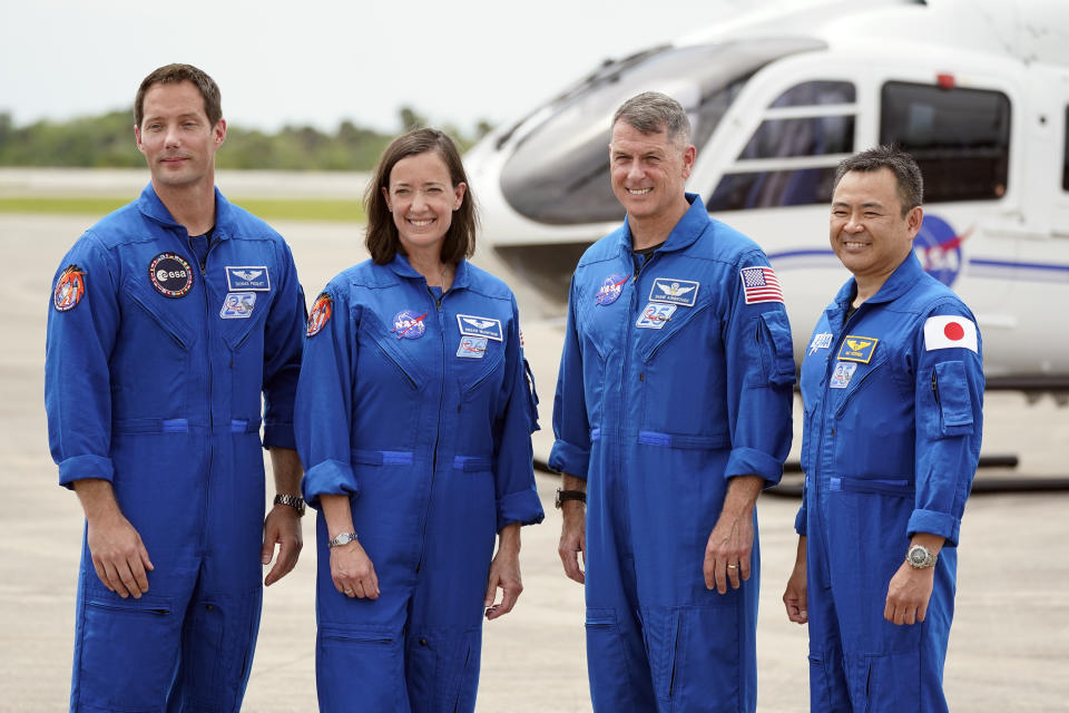 FILE - In this Friday, April 16, 2021 file photo, SpaceX Crew 2 members, from left, European Space Agency astronaut Thomas Pesquet, NASA astronauts Megan McArthur and Shane Kimbrough and Japan Aerospace Exploration Agency astronaut Akihiko Hoshide gather at the Kennedy Space Center in Cape Canaveral, Fla. This is the most internationally diverse crew yet for SpaceX. (AP Photo/John Raoux)