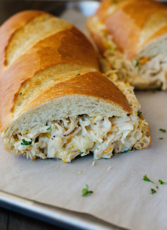 <p>This melty, crusty french bread sandwich pairs perfectly with a leafy green salad. Get the recipe <a href="http://life-in-the-lofthouse.com/chicken-stuffed-french-bread/" rel="nofollow noopener" target="_blank" data-ylk="slk:HERE;elm:context_link;itc:0;sec:content-canvas" class="link "><strong>HERE</strong></a>.</p>