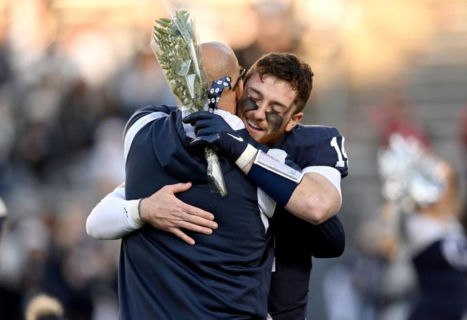 Penn State football coach James Franklin hugs senior Sean Clifford before the game against Michigan State on Saturday, Nov. 26, 2022.