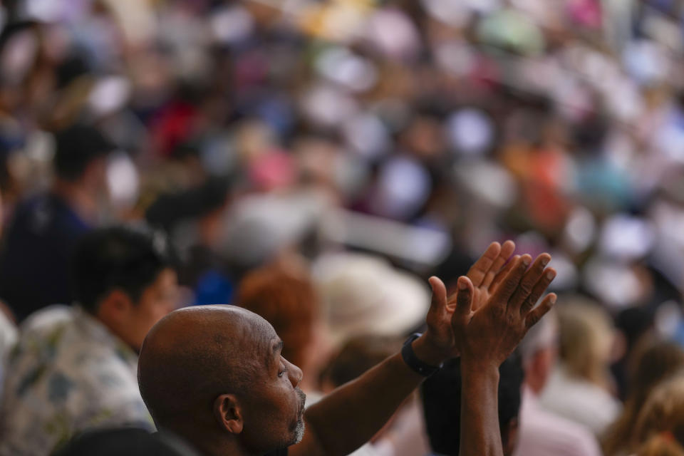 Tennis fans watch play during the first round of the U.S. Open tennis championships, Monday, Aug. 28, 2023, in New York. (AP Photo/Manu Fernandez)