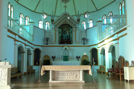 FILE PHOTO: The altar and a painting of the Virgin Mary, known locally as Our Lady of China, are seen at Our Lady of China Catholic Church in Donglu village, Hebei province, China October 3, 2018. Picture taken October 3, 2018. REUTERS/Christian Shepherd/File Photo