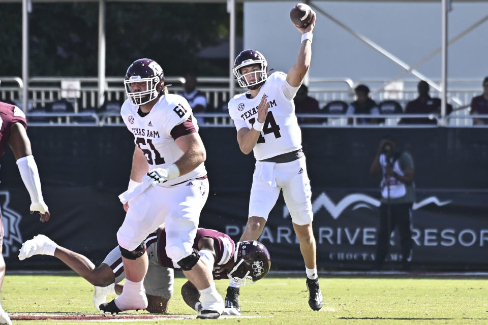 Oct 1, 2022; Starkville, Mississippi; Texas A&M Aggies quarterback Max Johnson (14) makes a pass against the Mississippi State Bulldogs during the first quarter at Davis Wade Stadium at Scott Field. Matt Bush-USA TODAY Sports