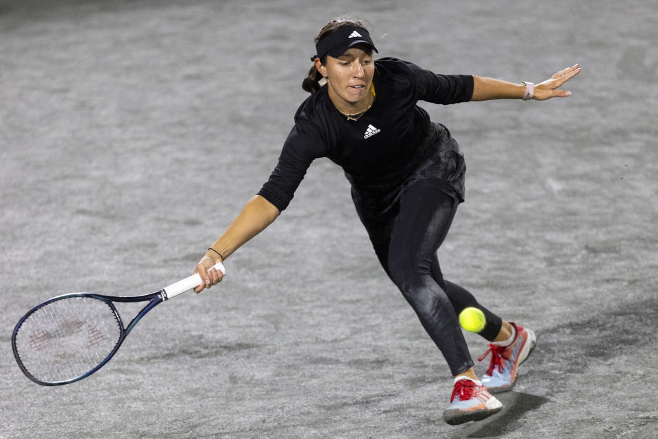 Jessica Pegula returns a shot to Belinda Bencic, of Switzerland, during semifinal action at the Charleston Open tennis tournament in Charleston, S.C., Saturday, April 8, 2023. (AP Photo/Mic Smith)