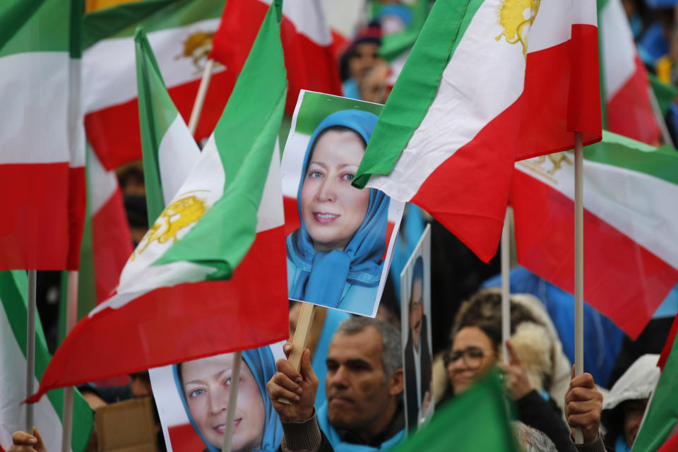 Demonstrators carry posters of Maryam Rajavi, the leader of the National Council of Resistance of Iran, during a protest in Paris, Friday Feb.8, 2019 as Iran marks the 40th anniversary of its Islamic Revolution. (AP Photo/Francois Mori)
