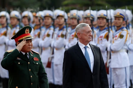 U.S. Secretary of Defense Jim Mattis (R) and Vietnam's Defence Minister Ngo Xuan Lich review the guard of honour during a welcoming ceremony in Hanoi, Vietnam January 25, 2018. REUTERS/Kham