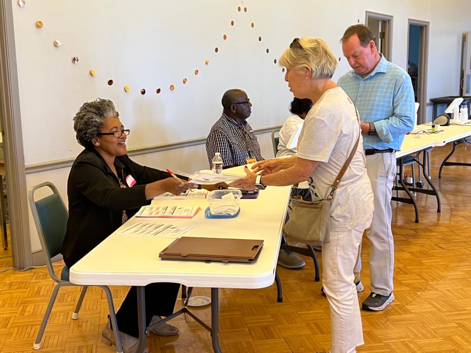 Voters sign in to and cast their ballots at First United Methodist Church in Ridgeland.