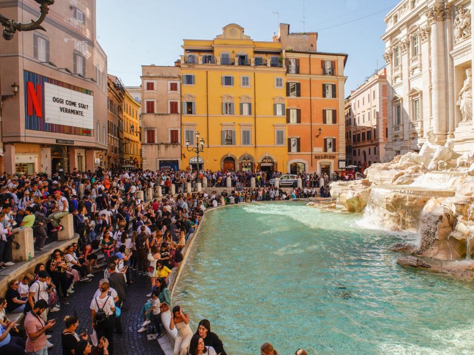 Crowds swarm the Trevi Fountain in Rome in October 2022.