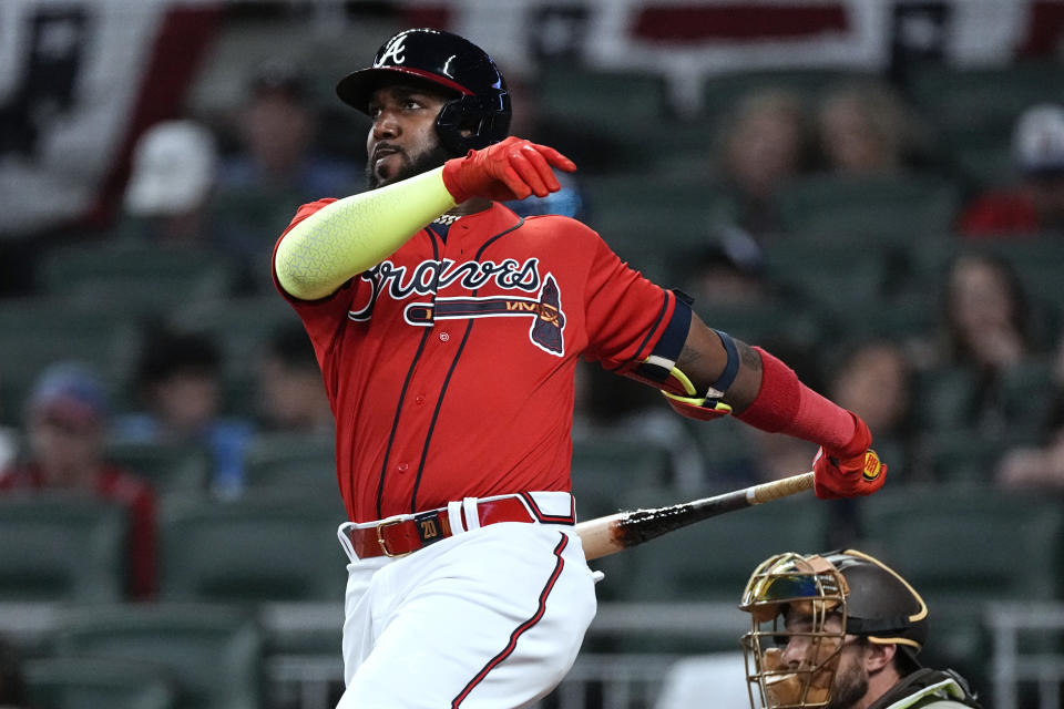 Atlanta Braves' Marcell Ozuna watches his solo home run against the San Diego Padres during the third inning of a baseball game Friday, April 7, 2023, in Atlanta. (AP Photo/John Bazemore)