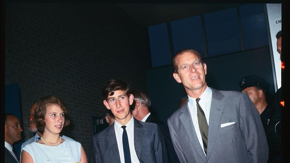 prince phillip standing with children