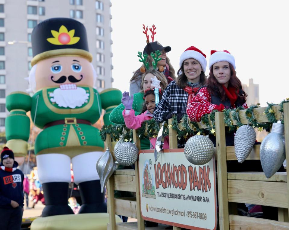 Stroll on State parade participants ride a wagon from Lockwood Park on Saturday, Nov. 27, 2021, in downtown Rockford.