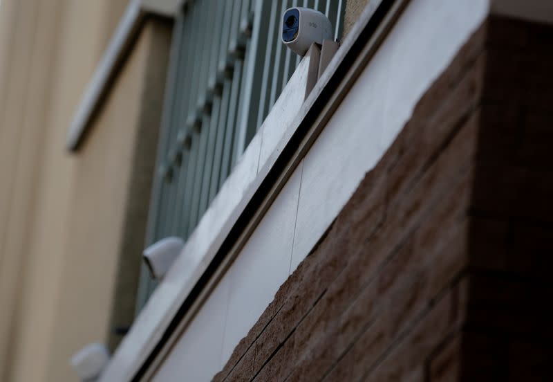 Three wireless security cameras installed above the entrance of the Tokyo residence of former Nissan chairman Carlos Ghosn are pictured, while prosecutors raid the house, in Tokyo