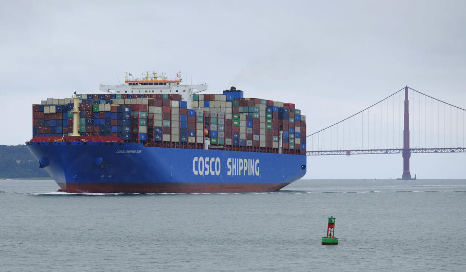 A Cosco Shipping container ship passes the Golden Gate Bridge Tuesday, May 14, 2019, in San Francisco bound for the Port of Oakland. The United States and China are raising tariffs on tens of billions of dollars' worth of each other's imports, escalating a trade war, spooking financial markets and casting gloom over the prospects for the world economy. (AP Photo/Eric Risberg)