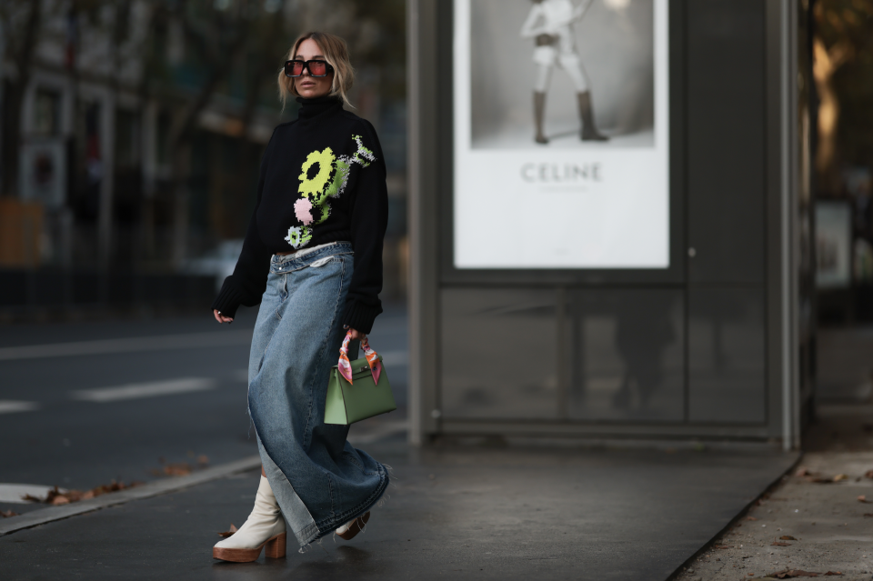 woman in denim maxi skirt and sweater