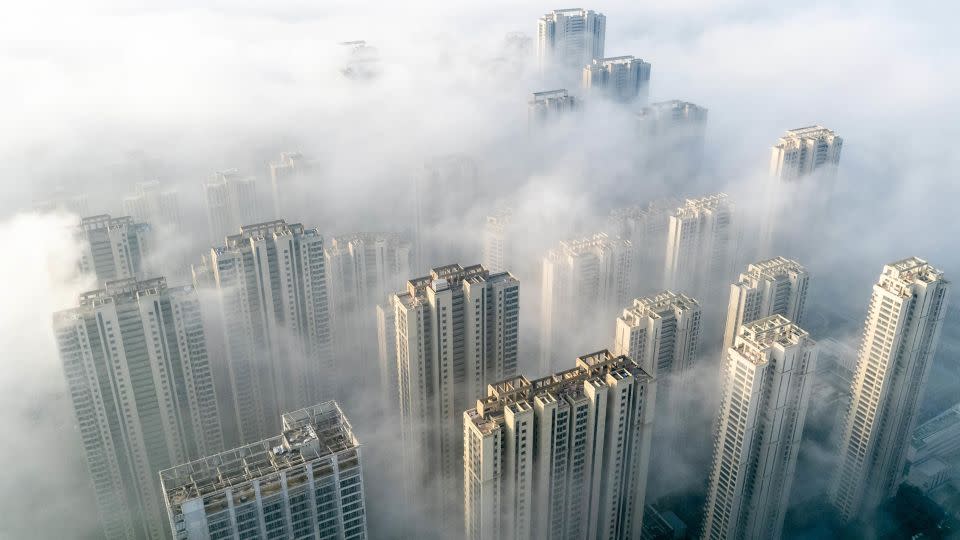 This aerial photo taken on November 27, 2023 shows fog over residential buildings in Wuhan, in China's central Hubei province. - Stringer/AFP/Getty Images