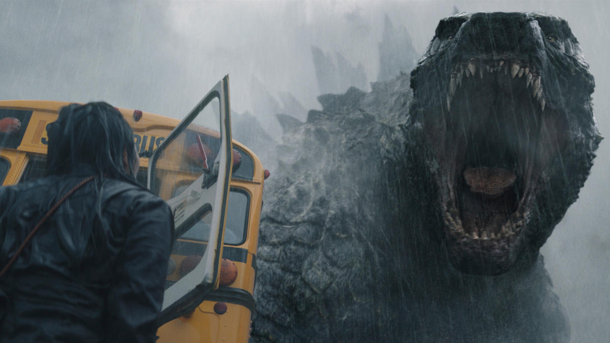  Godzilla roars at a person who's standing next to a school bus in Monarch: Legacy of Monsters, one of the best Apple TV Plus shows. 