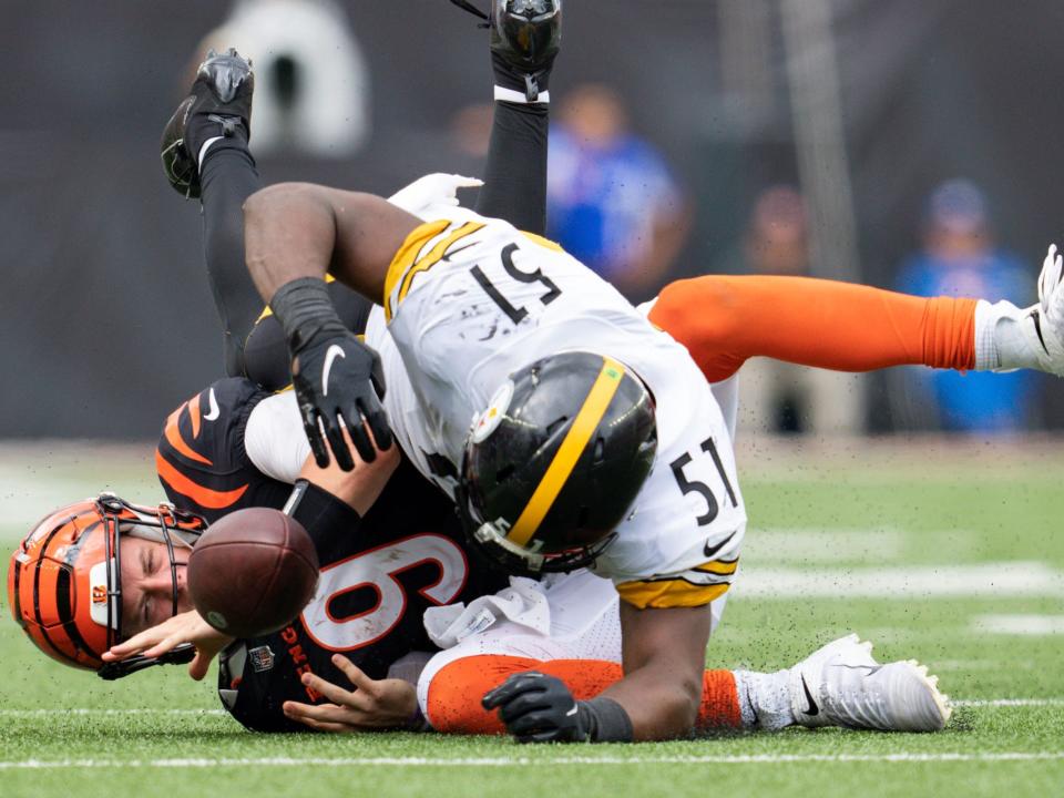 Joe Burrow takes a big hit from the Pittsburgh Steelers defense.