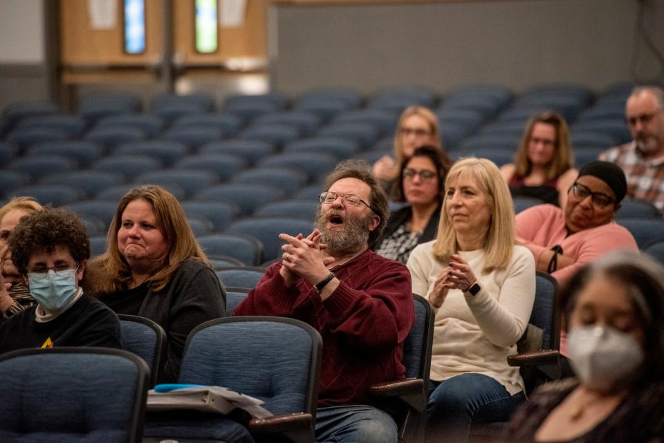 People cheer as a public speaker asks the Randolph Board of Education to keep the schools closed during Rosh Hashana on March 22, 2022.