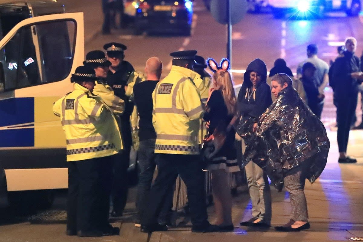 Police with survivors close to the Manchester Arena after the May 22 terror attack. (PA)