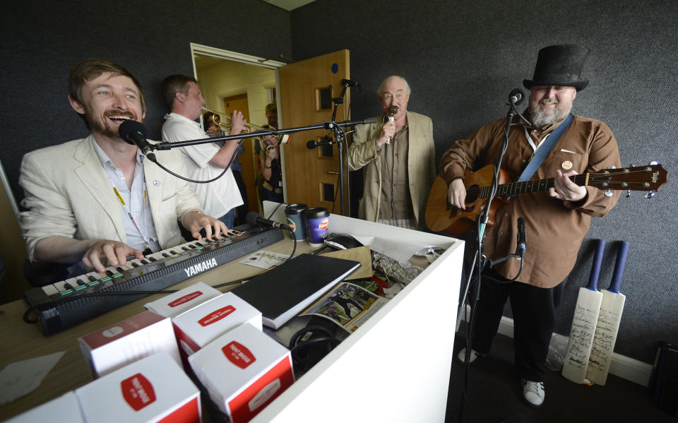 The Duckworth Lewis method which comprises of Neil Hannon (L) and Thomas Walsh (R) are joined by trumpeter Billy Cooper and Henry Blofeld (2nd R) as they perform a song for BBC's Test Match Special during the first Ashes cricket test match between England and Australia at Trent Bridge cricket ground in Nottingham, England July 12, 2013. REUTERS/Philip Brown (BRITAIN - Tags: SPORT CRICKET ENTERTAINMENT)