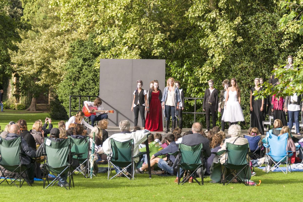 people enjoying Shakespeare play outside