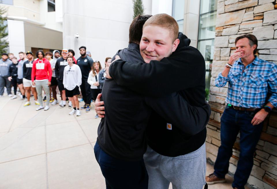 Connor Lair hugs Missouri State Football Head Coach Ryan Beard after Lair rang the bell outside Mercy Children's Hospital on Tuesday, Feb. 6, 2024, symbolizing that he is finished with chemotherapy treatment for Hodgkins Lymphoma that he was diagnosed with in the fall of 2023.