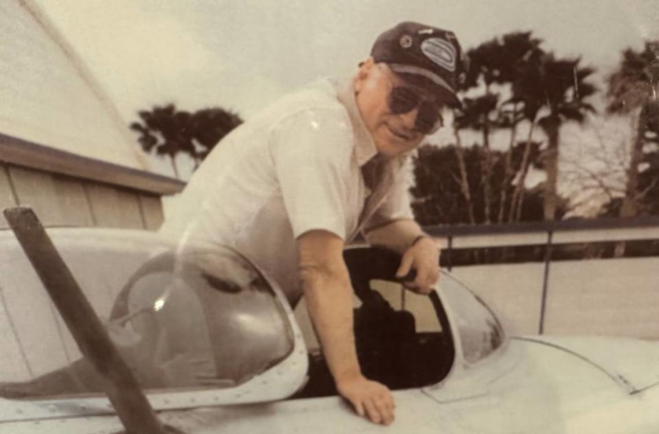 Curtis Earl, who was also a pilot and aircraft collector, sits in the cockpit of his MiG-15 Soviet fighter jet in this undated photo.