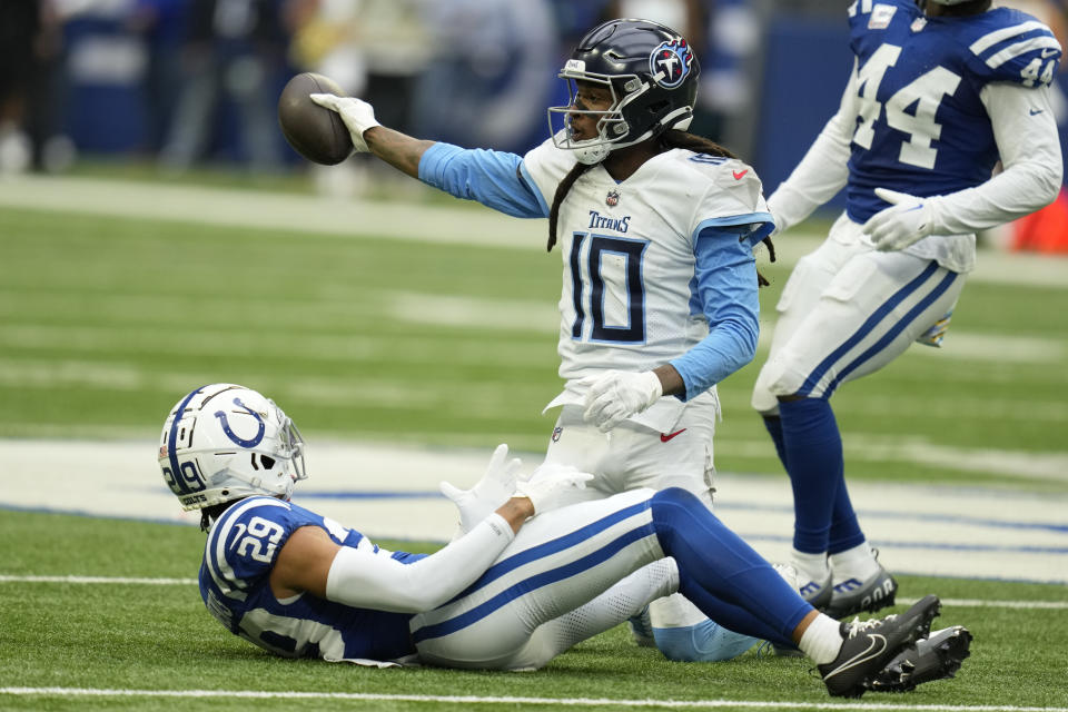 Tennessee Titans wide receiver DeAndre Hopkins (10) signals for a first down after catch against Indianapolis Colts cornerback JuJu Brents (29) during the second half of an NFL football game, Sunday, Oct. 8, 2023, in Indianapolis. (AP Photo/Michael Conroy)