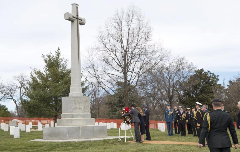Prime Minister Justin Trudeau, his wife Sophie Gregoire Trudeau and Defence Minister Harjit Sajjan the Canadian Cross of Sacrifice at the Arlington Cemetery Friday, March 11, 2016 in Arlington, Virginia. THE CANADIAN PRESS/Paul Chiasson