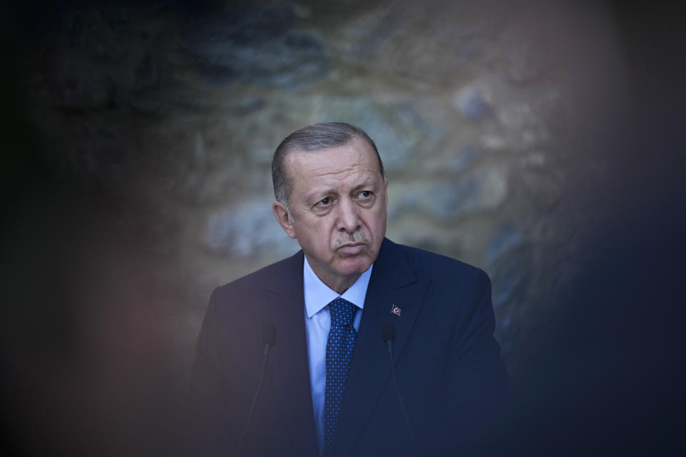 Turkey's President Recep Tayyip Erdogan listens to a question during a joint news conference with German Chancellor Angela Merkel following their meeting at Huber Villa presidential palace, in Istanbul, Turkey, Saturday, Oct. 16, 2021. The leaders discussed Ankara's relationship with Germany and the European Union as well as regional issues including Syria and Afghanistan. (AP Photo/Francisco Seco)