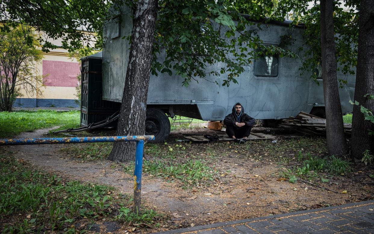 Belarusian web developer Andrey Fedorovich found himself underneath an abandoned van for an hour while riot police were chasing protesters across Minsk on the election night on Aug 9 - Misha Friedman